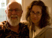 Two people smiling together indoors at the cafe